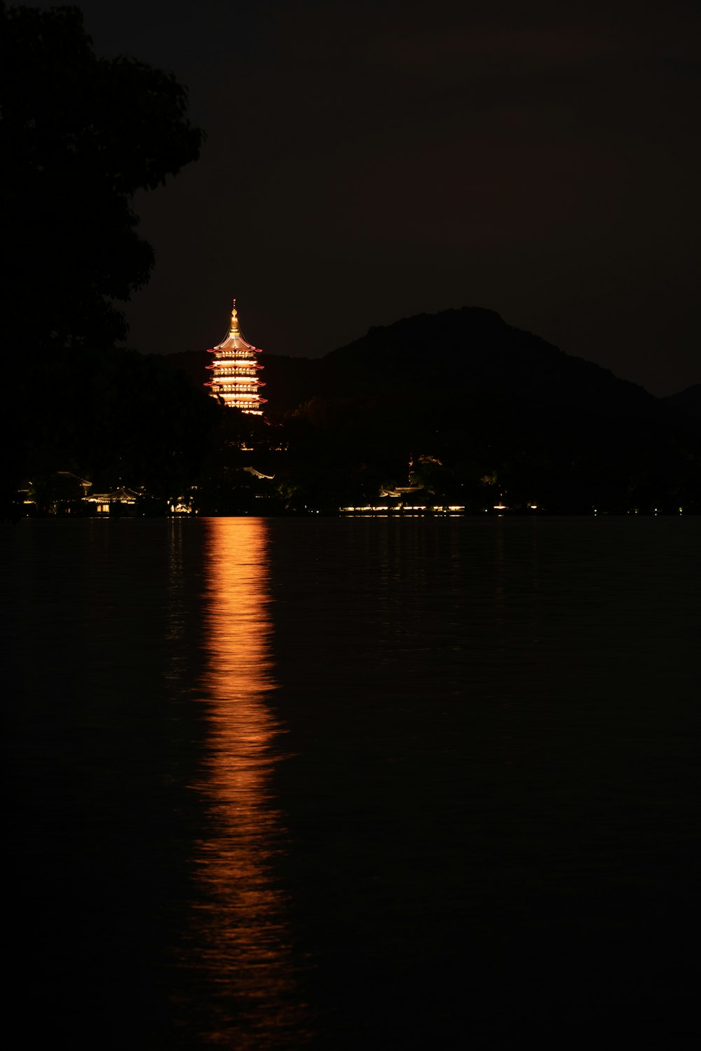 a full view of a building lit up at night