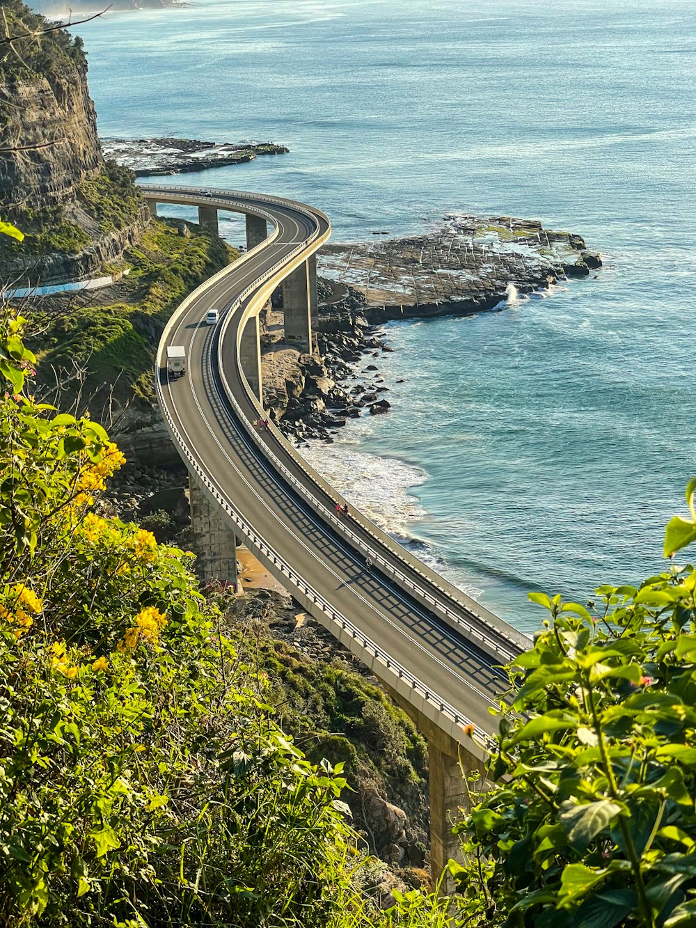 a view of a highway going over the ocean