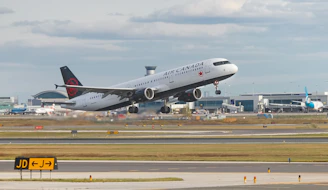 a large jetliner taking off from an airport runway