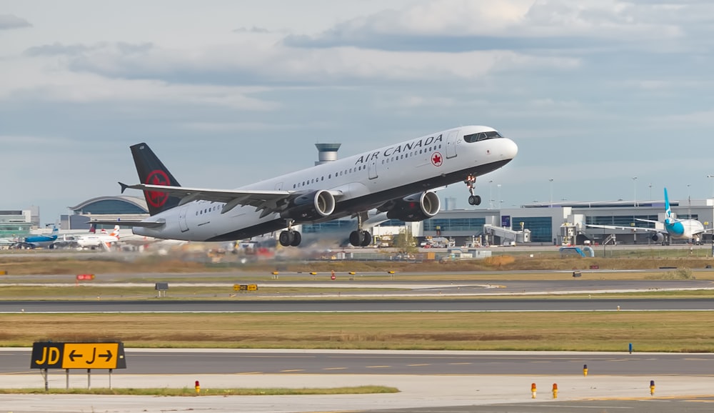 a large jetliner taking off from an airport runway