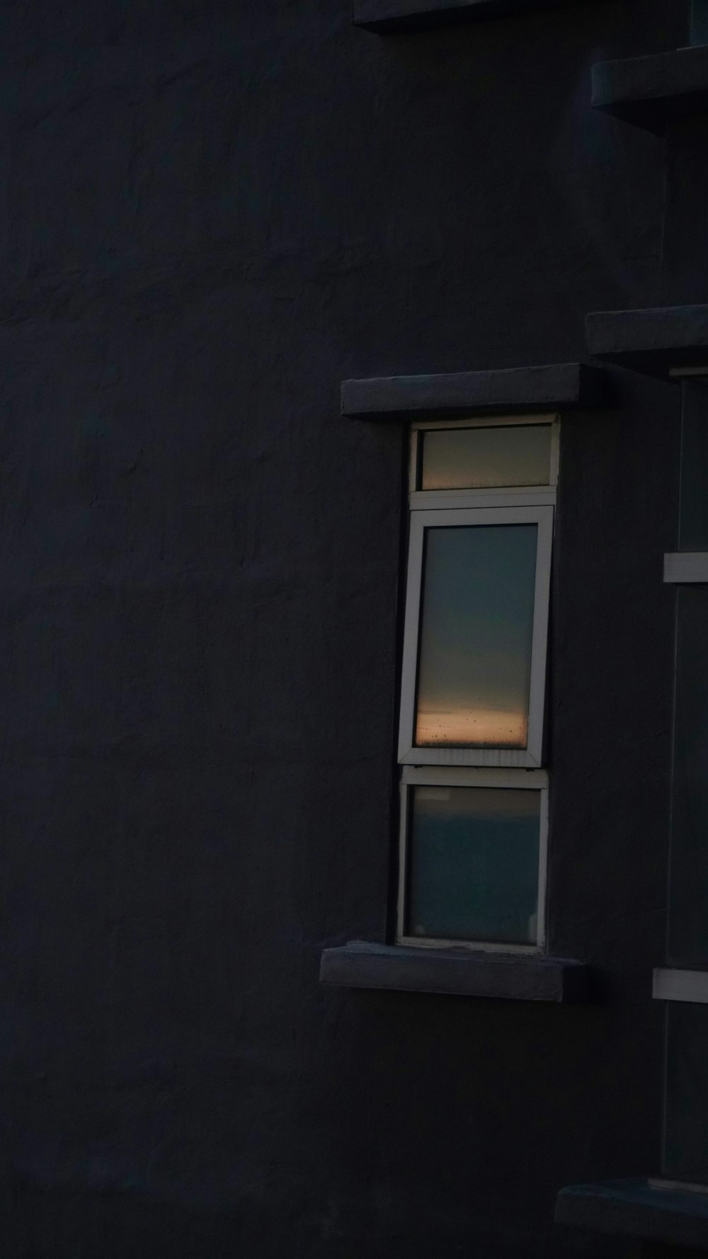 a building with a window and a clock on it