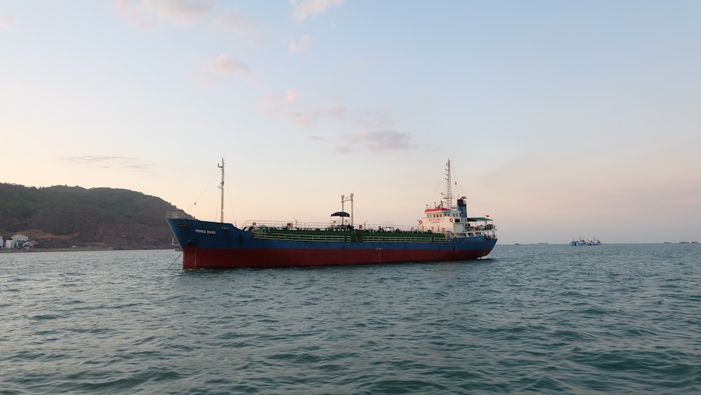 a large boat floating on top of a body of water