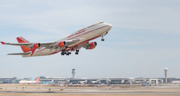 a large jetliner flying through a blue sky