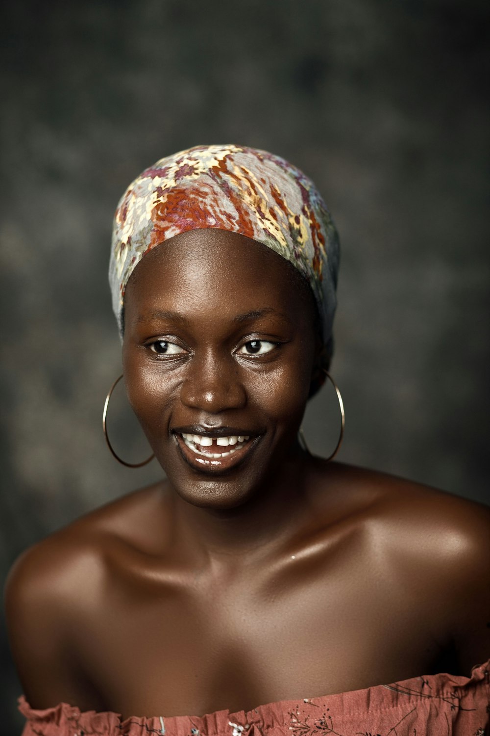 a woman with a head scarf on her head