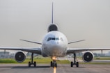 a large jetliner sitting on top of an airport runway