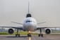 a large jetliner sitting on top of an airport runway