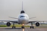 a large jetliner sitting on top of an airport runway