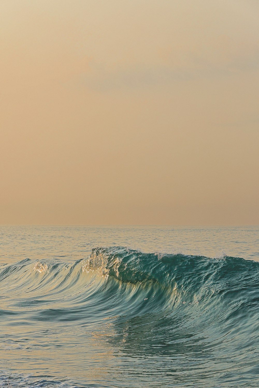 a person riding a surfboard on a wave in the ocean