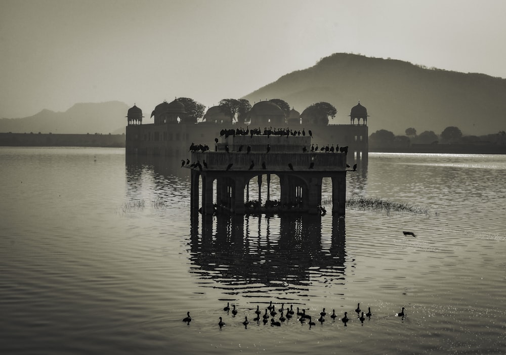 a large body of water with a pier in the middle of it