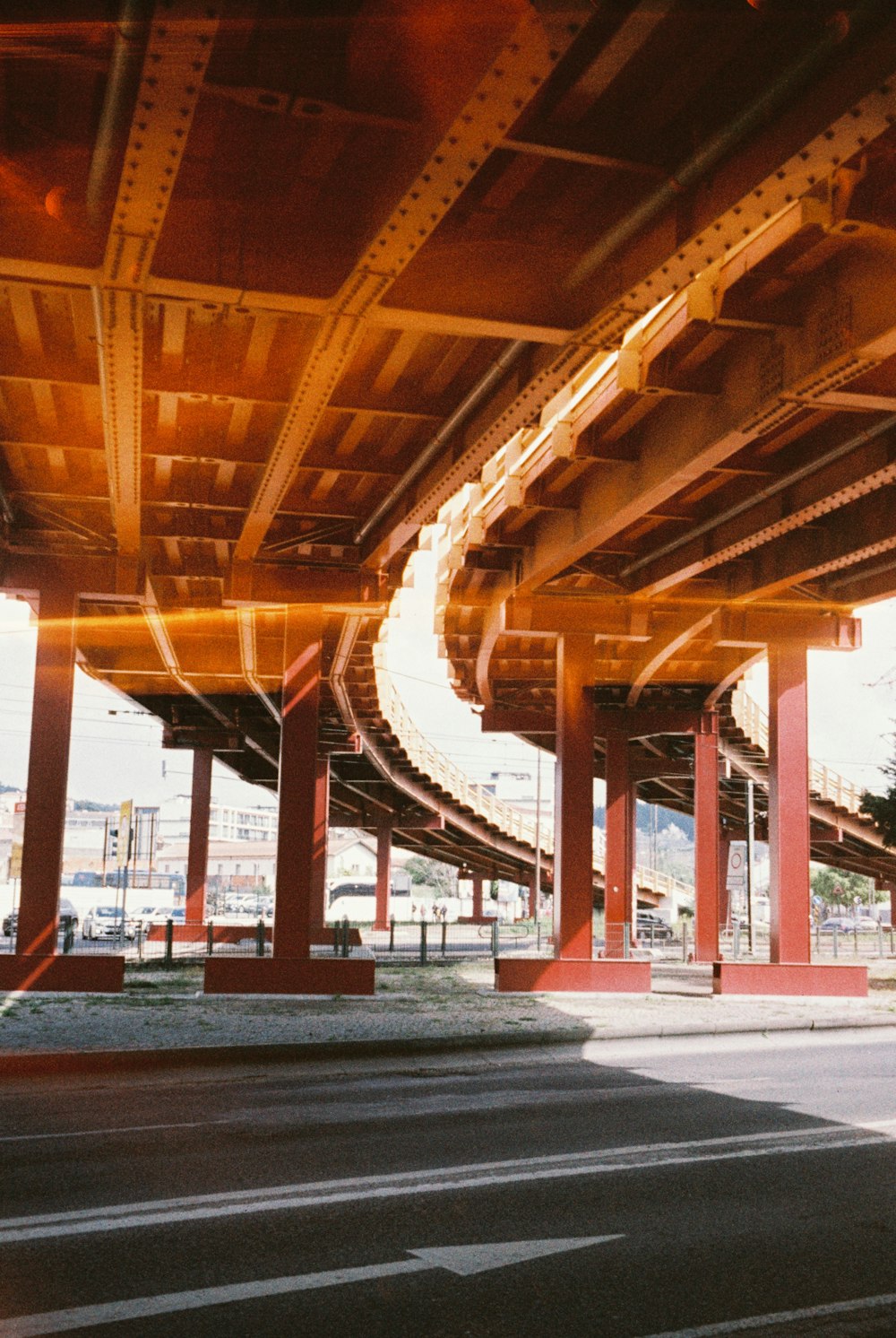 a picture of a street under a bridge