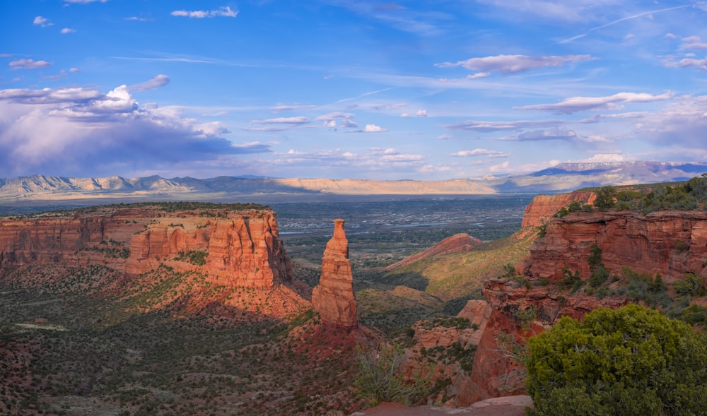 a scenic view of a mountain range with mountains in the background