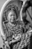 a woman in a turban looking in a mirror