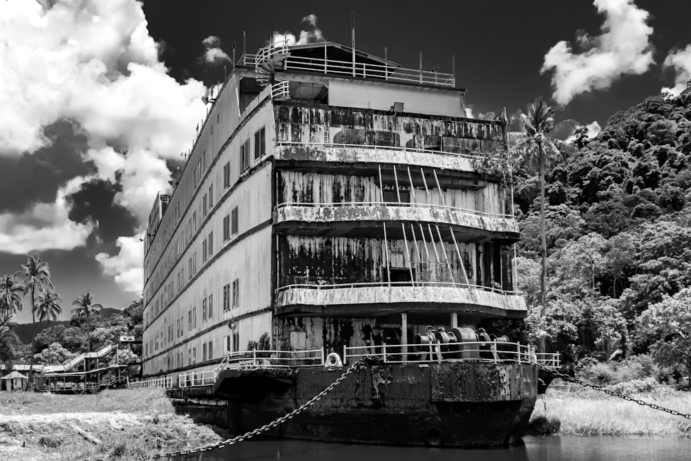 a large building sitting next to a body of water