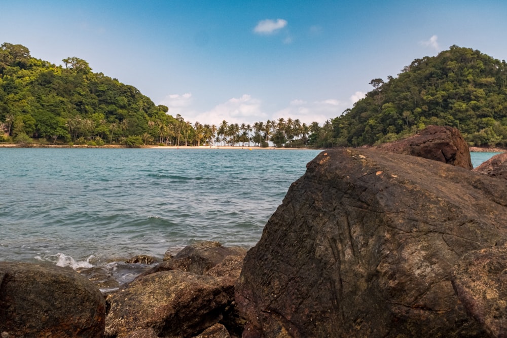 a view of the ocean from a rocky shore