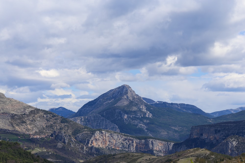 a view of a mountain range with a cloudy sky