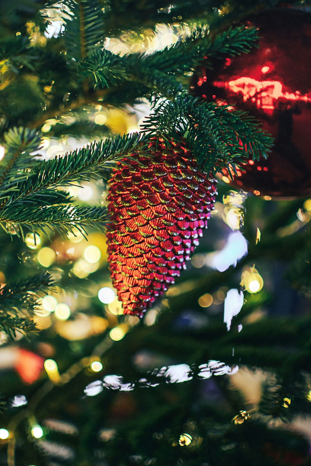 Toy bump on a green Christmas tree in the house