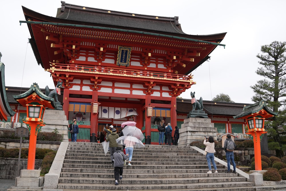 a group of people walking up some steps