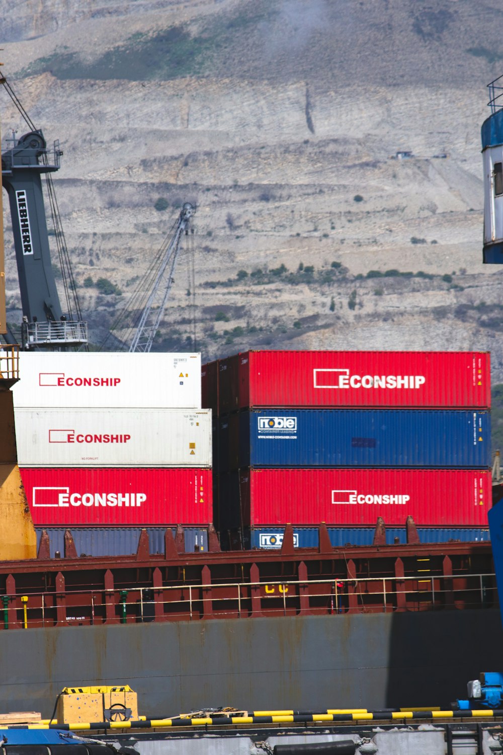 a large cargo ship with a crane on top of it