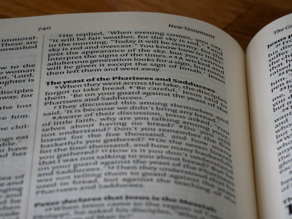 a close up of an open book on a table