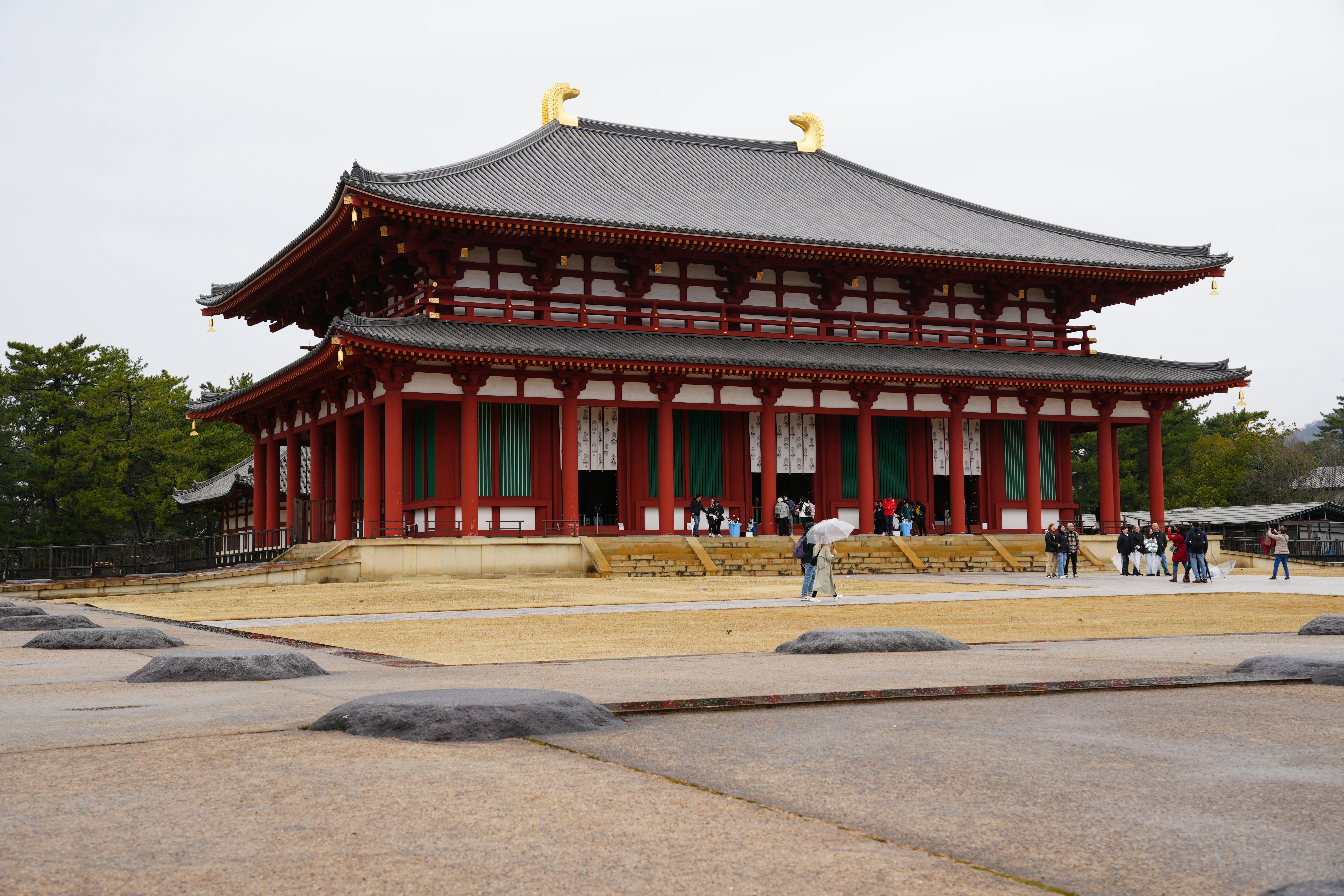 a red and white building with people standing in front of it, Kofuku-ji Kari Kodo (Temporary Lecture Hall). Nara. Japan.