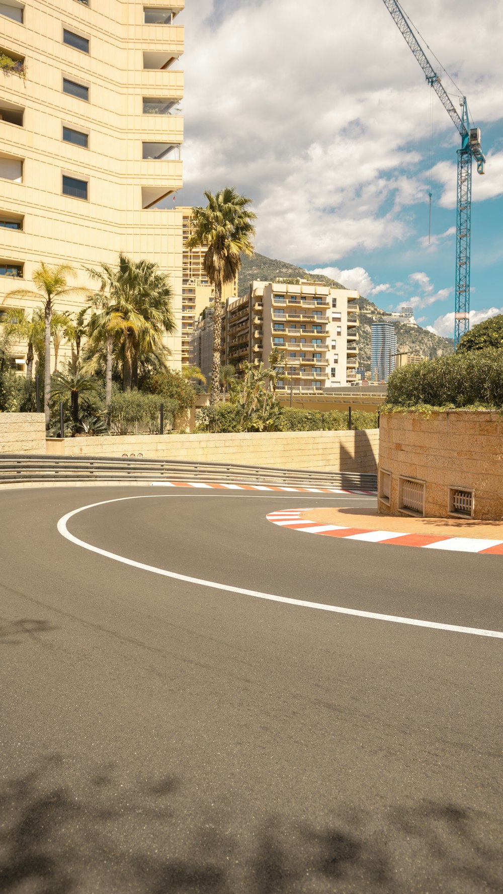 a man riding a skateboard down a curvy street