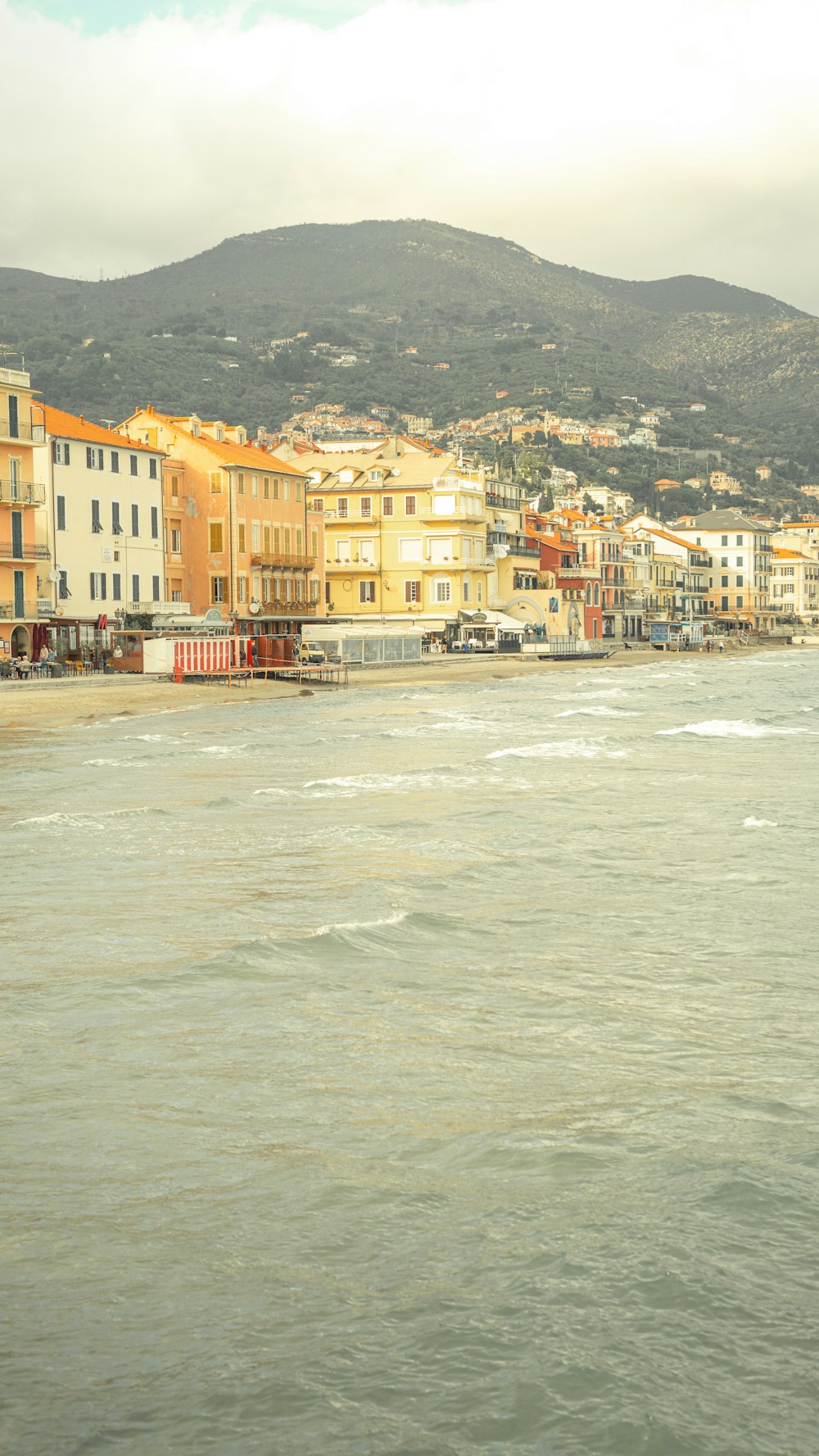 a body of water with buildings in the background