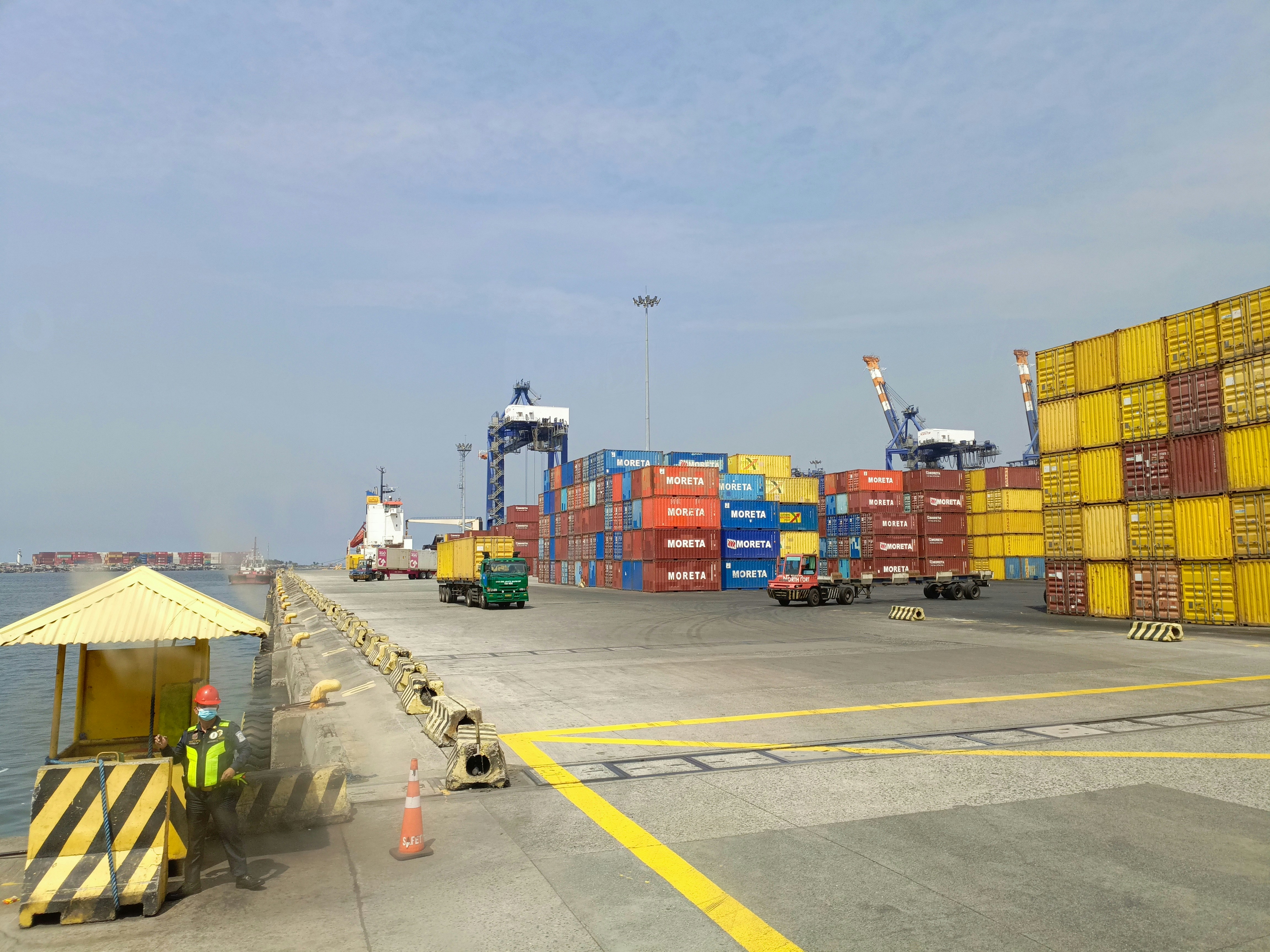 a dock with a lot of containers on it