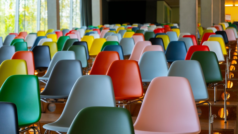 a room filled with lots of colorful chairs