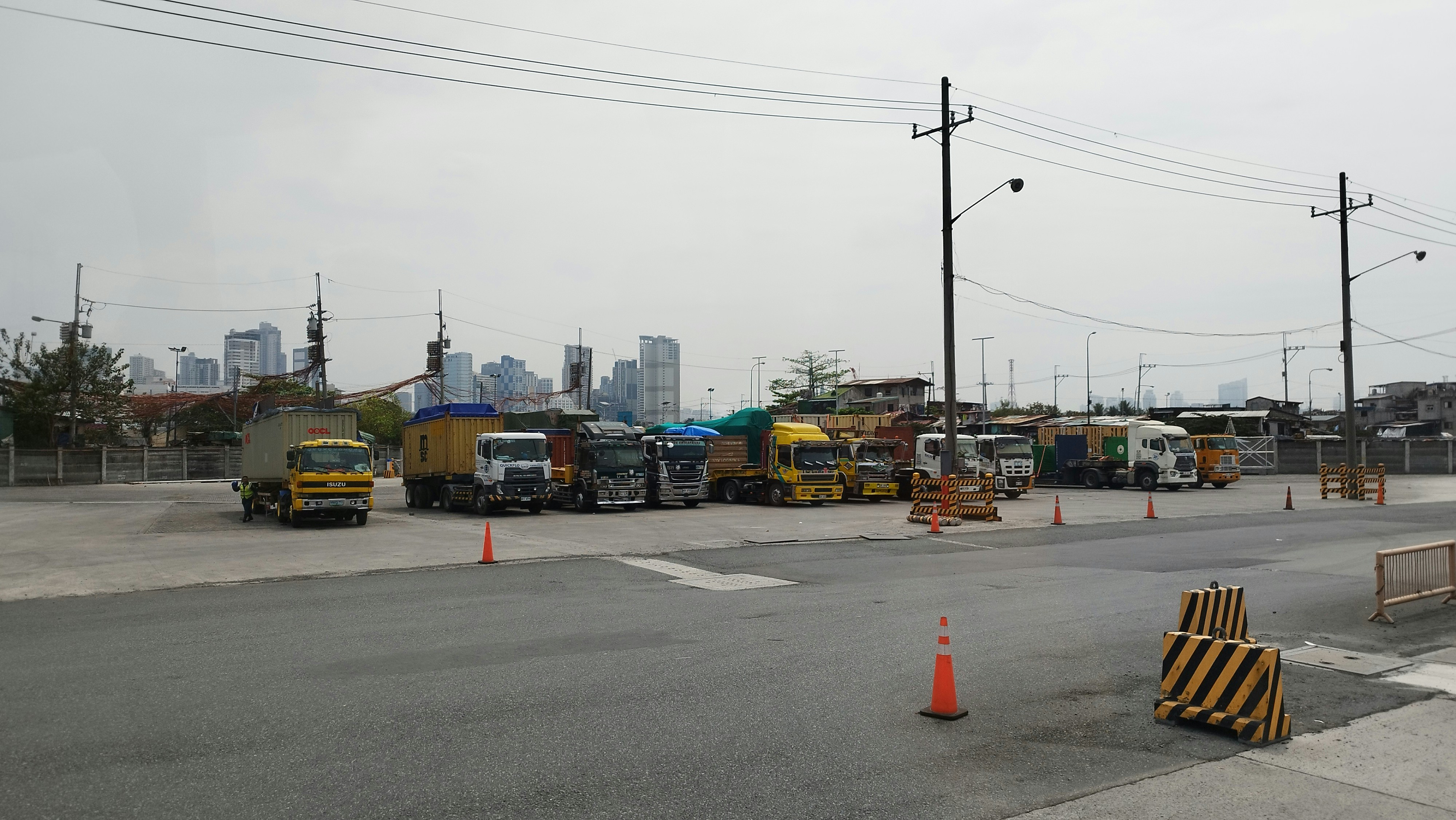 a group of trucks parked on the side of a road