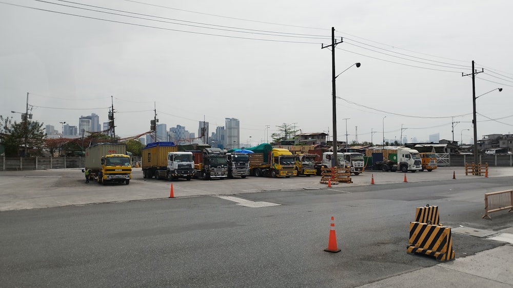 a group of trucks parked on the side of a road