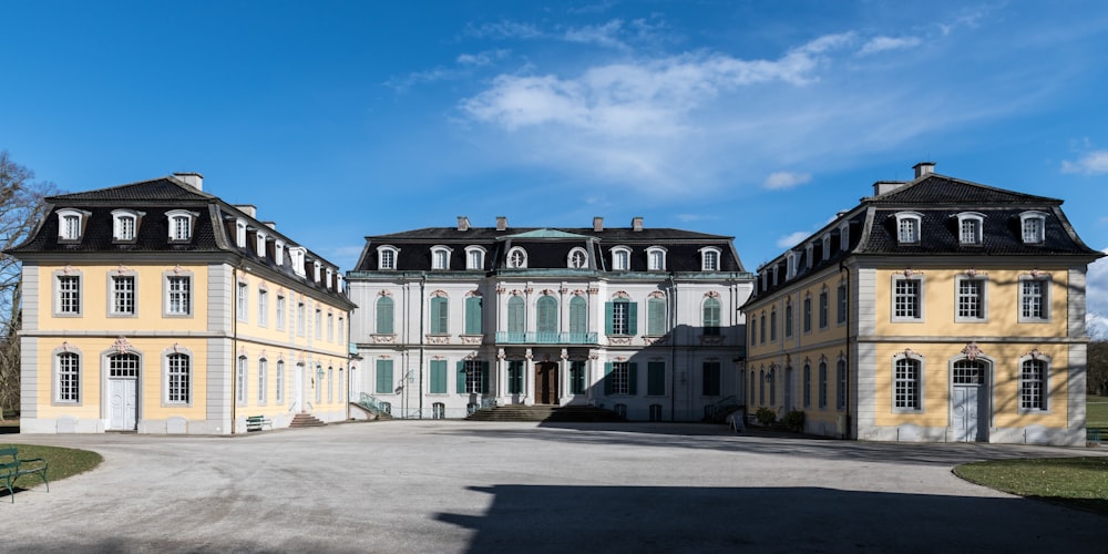 a large yellow building with a lot of windows