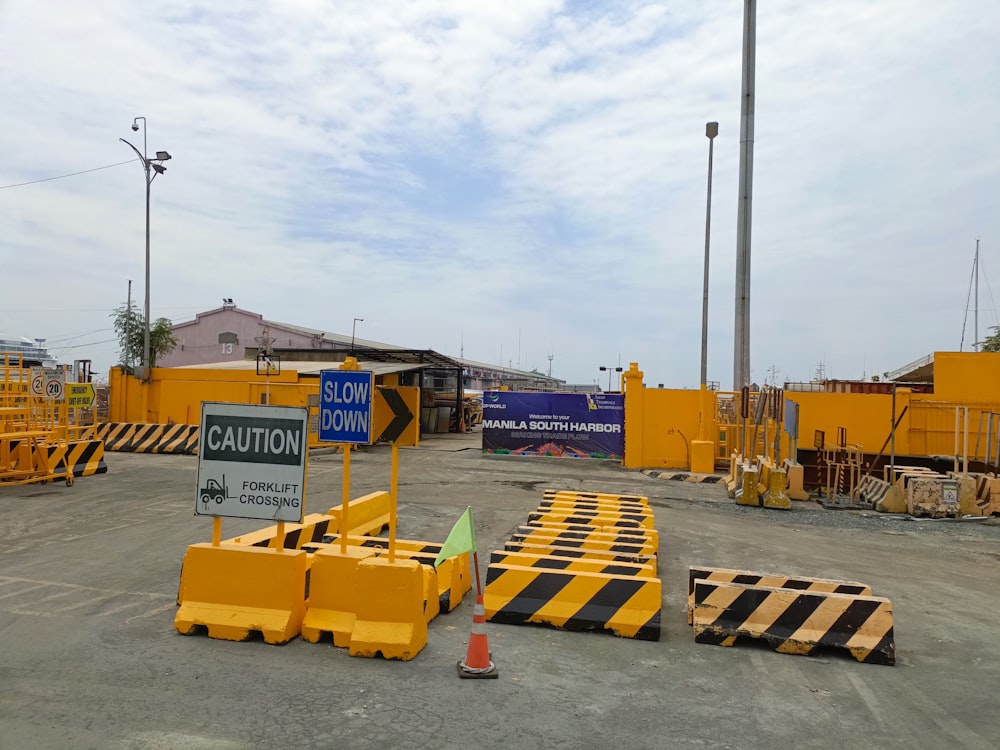 a parking lot with a yellow and black barricade