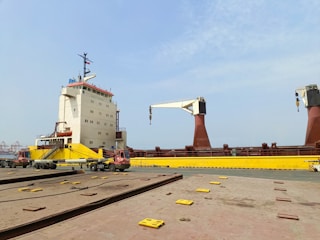 a large crane sitting on top of a train track