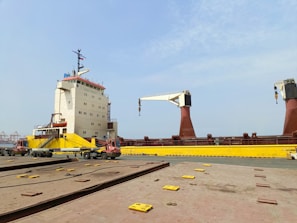 a large crane sitting on top of a train track