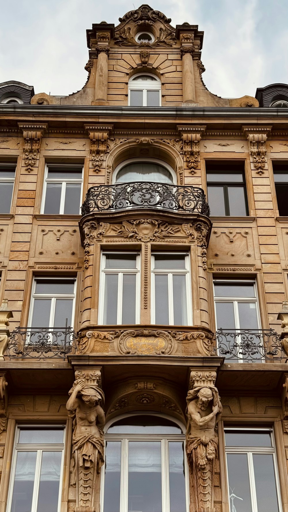 a tall building with many windows and balconies