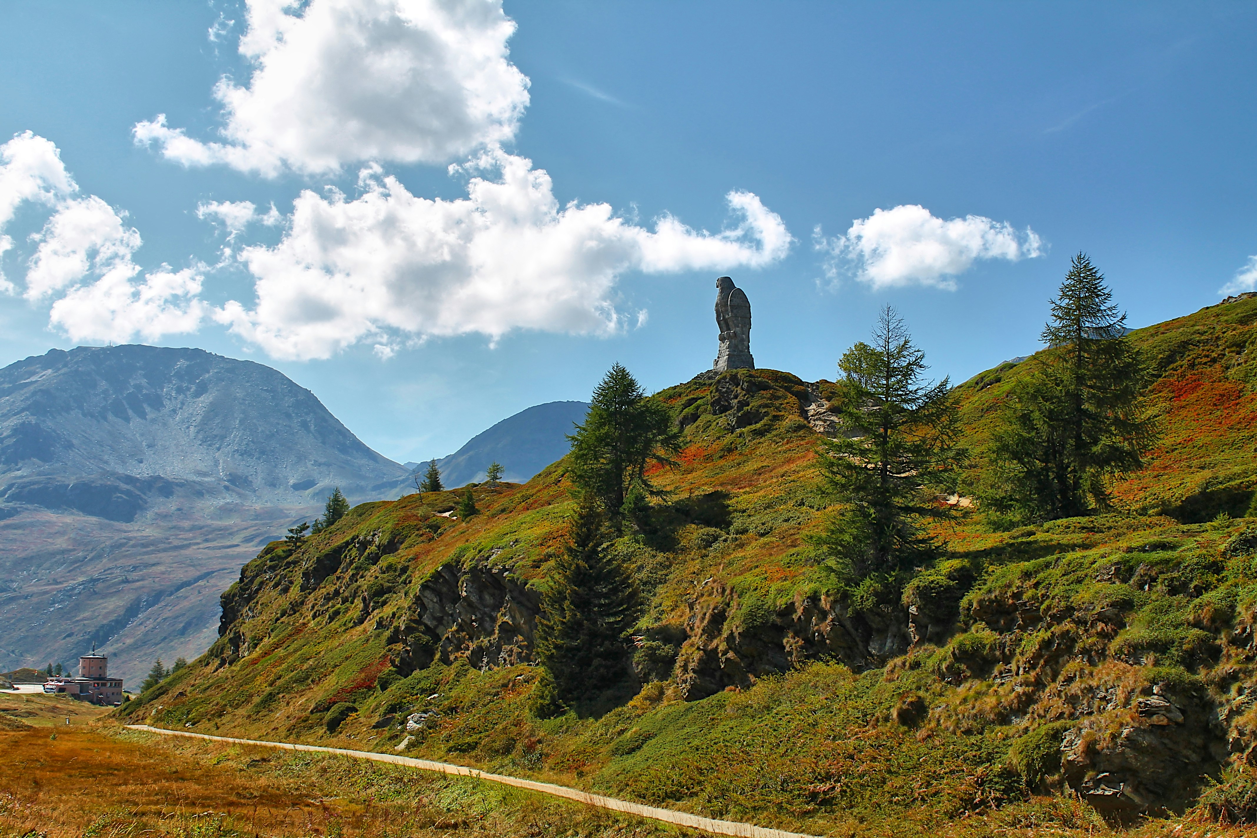 a scenic view of a mountain with a road going through it