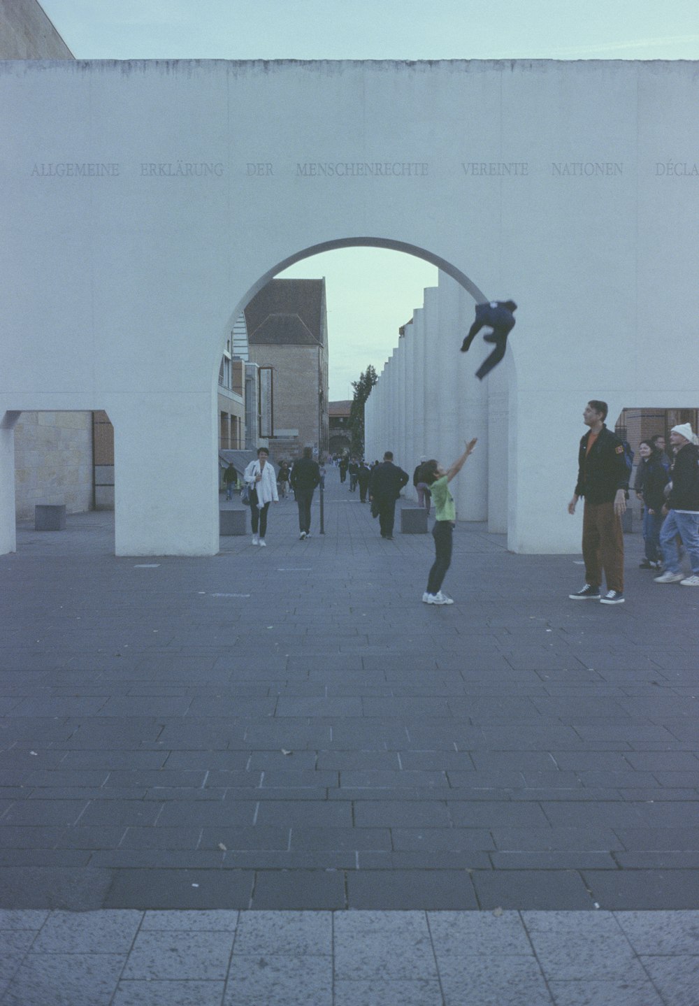 a person jumping in the air with a skateboard