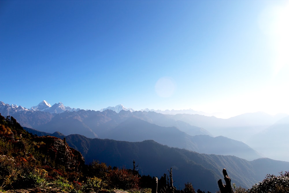 a view of a mountain range with mountains in the background