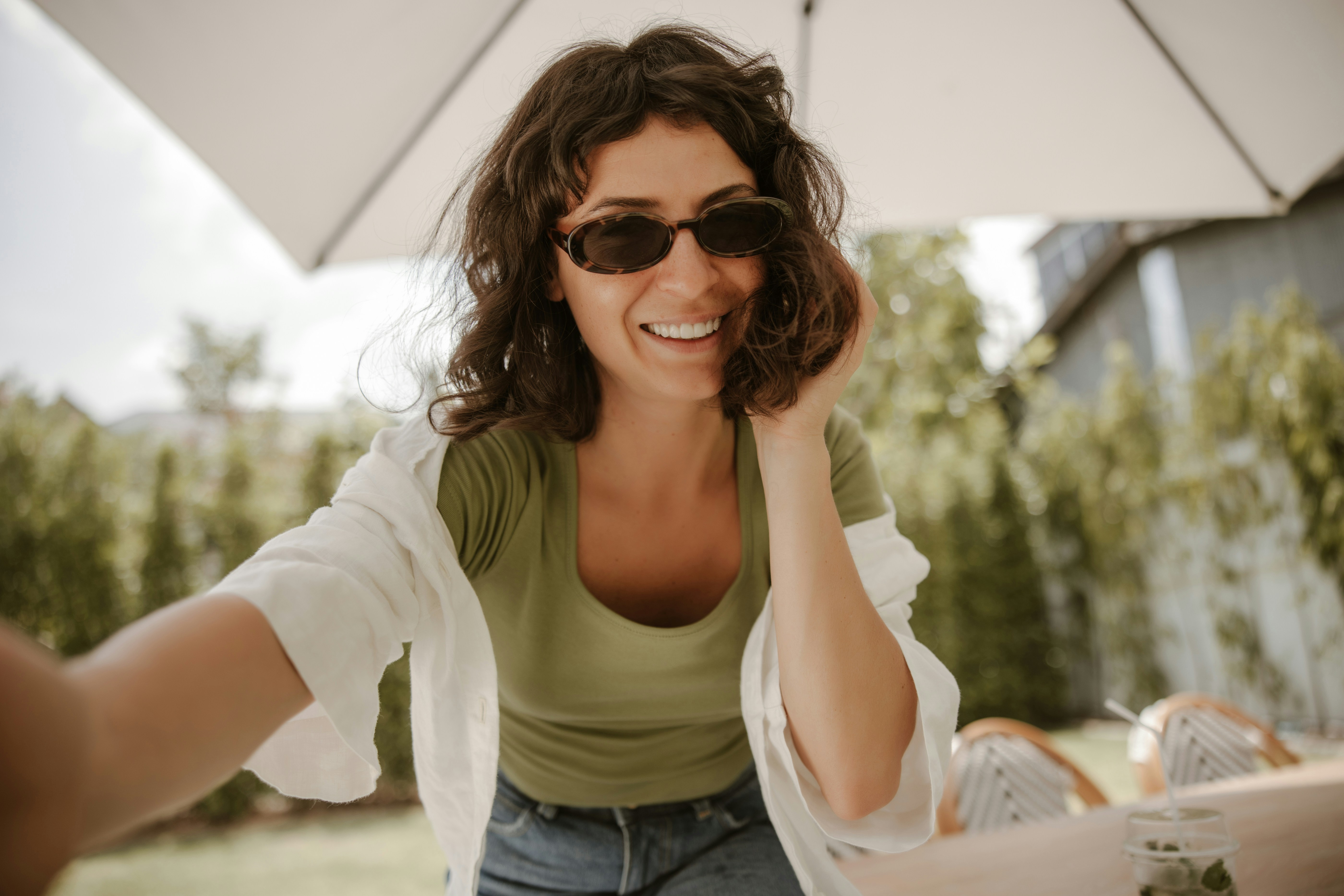 Flat lay of influencer content planning with phone and notebook on desk