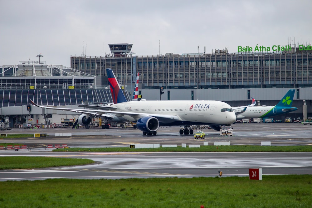 a large jetliner sitting on top of an airport runway