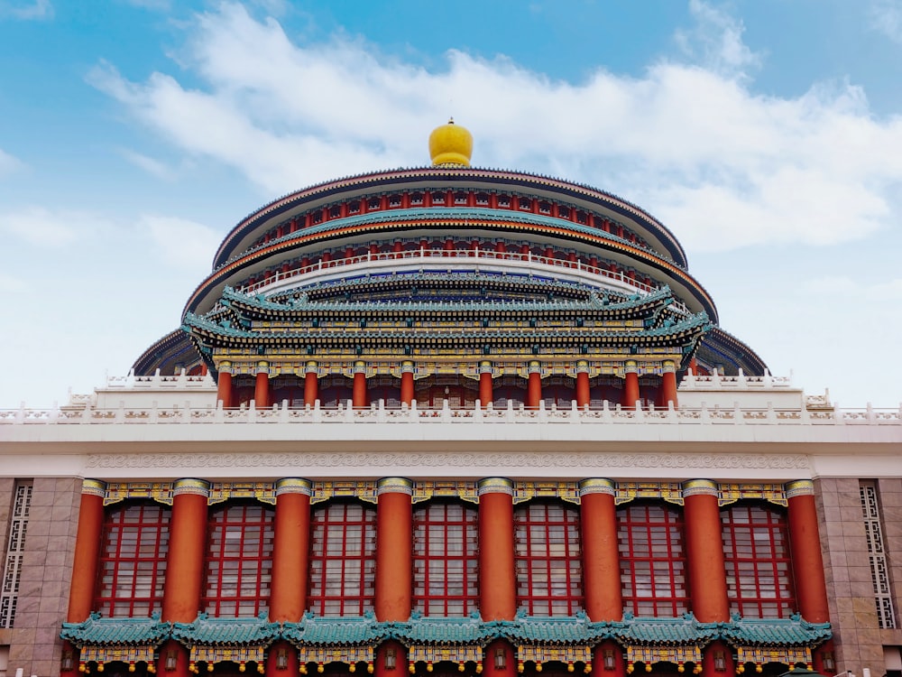 a large building with a yellow dome on top of it