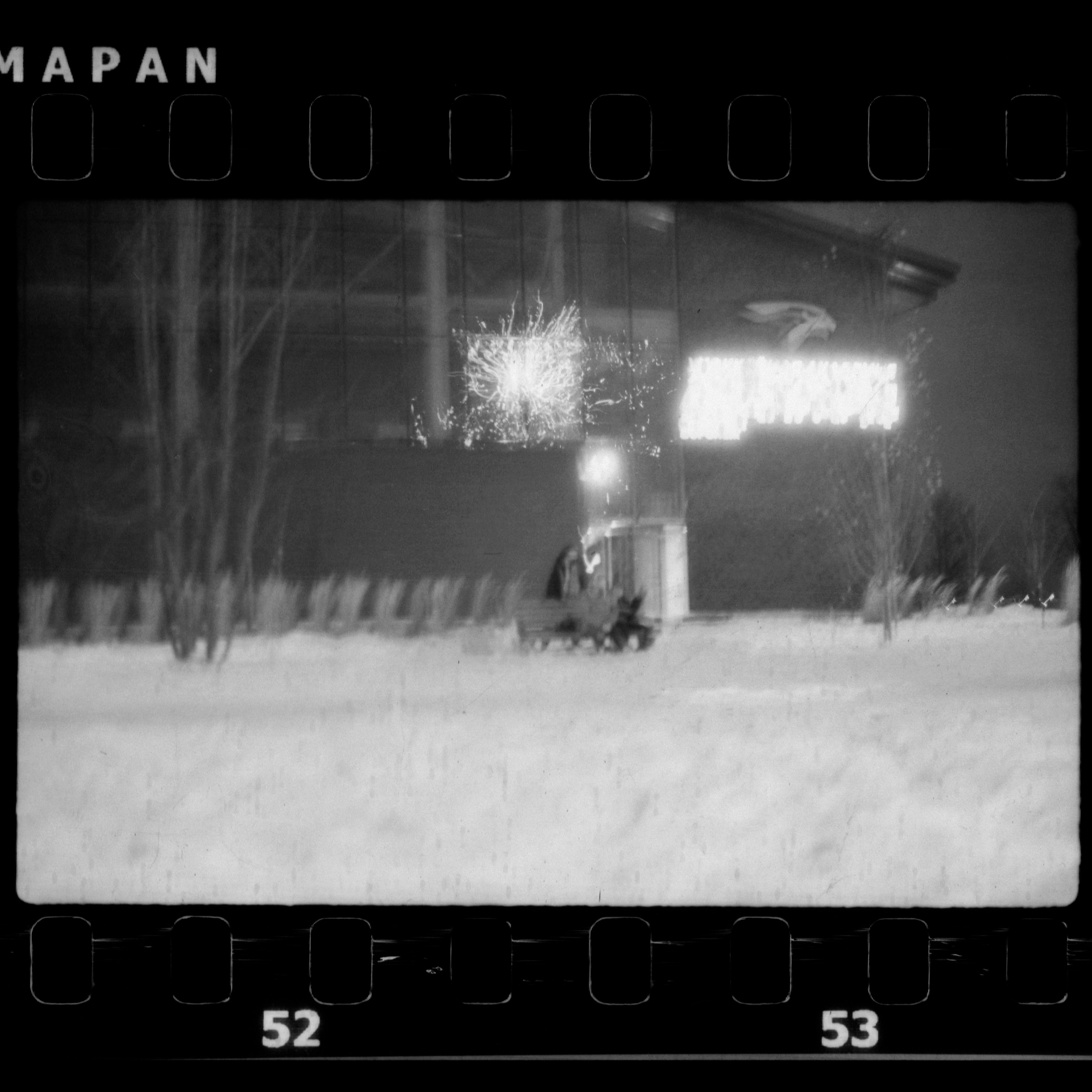 a black and white photo of a building in the snow