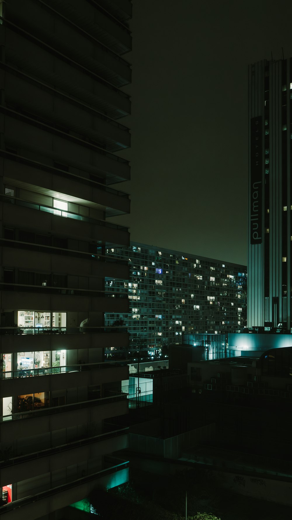 a view of a city at night from a high rise building