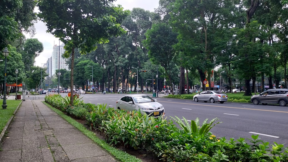 a city street with cars driving down it