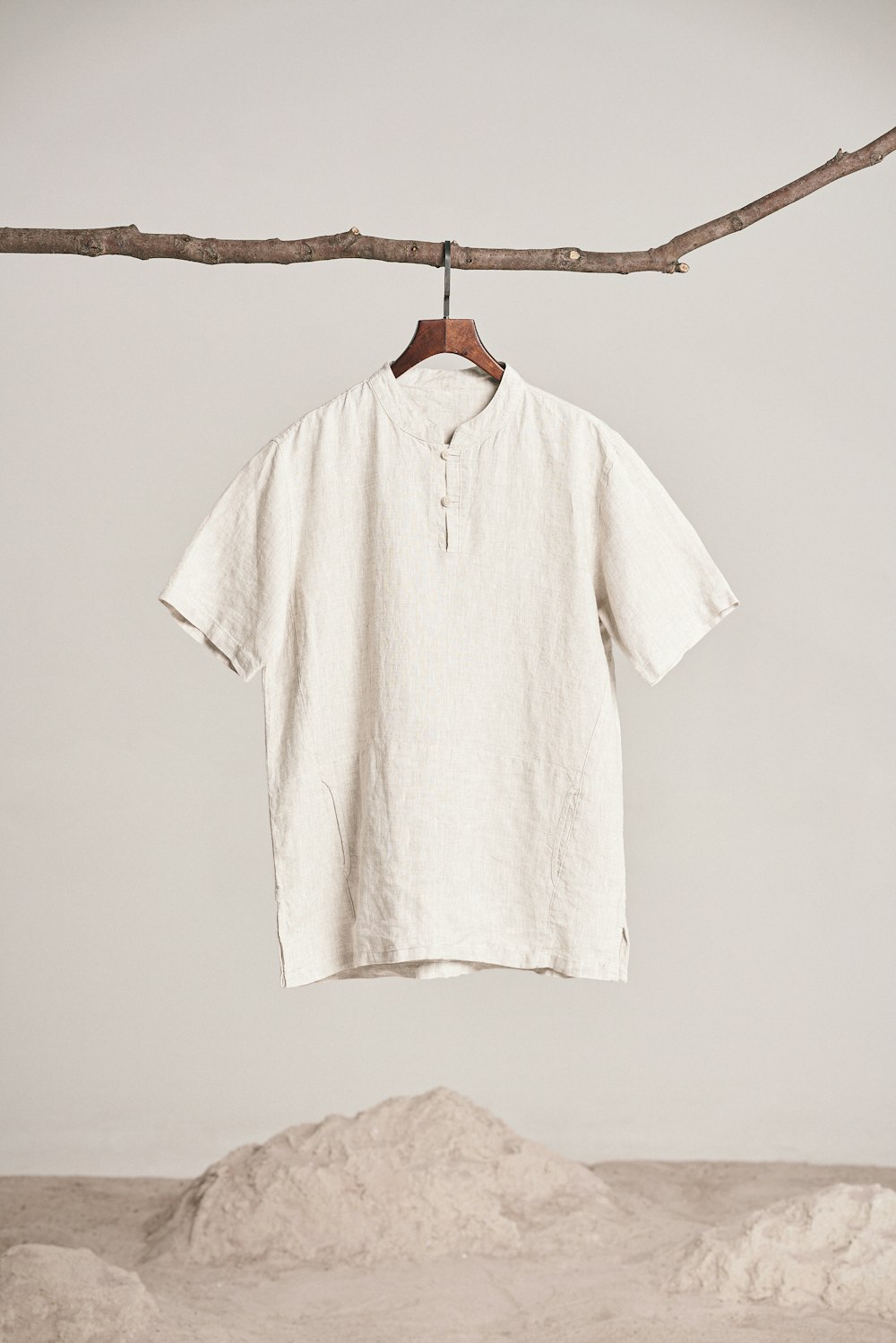 a white shirt hanging on a clothes line