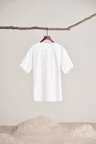 a white shirt hanging on a clothes line