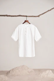 a white shirt hanging on a clothes line