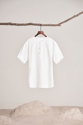 a white shirt hanging on a clothes line