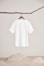 a white shirt hanging on a clothes line