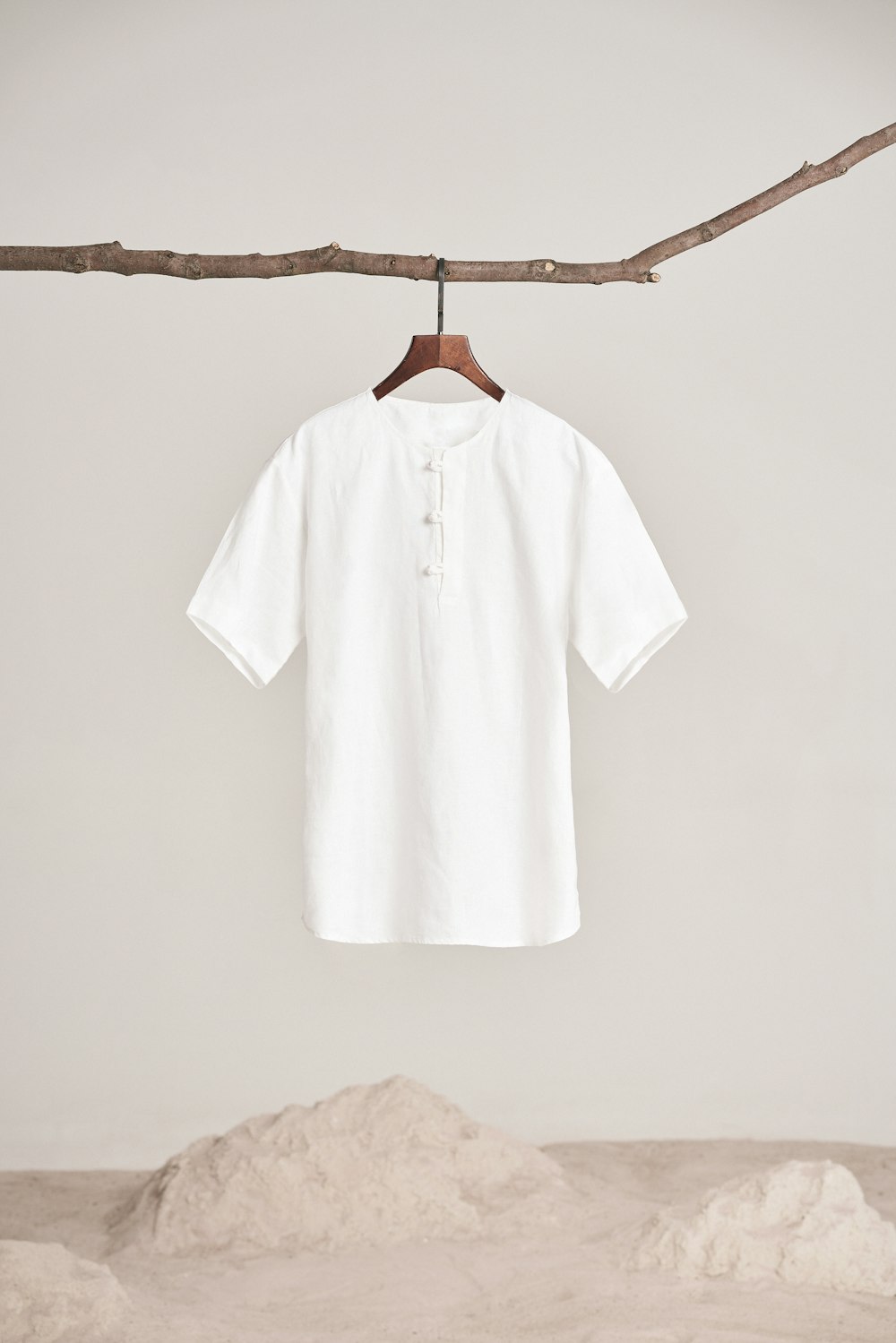 a white shirt hanging on a clothes line